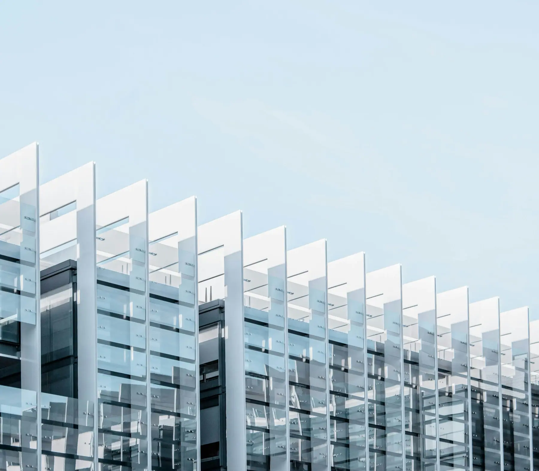 Glass and white louvre facade of a modern commercial building
