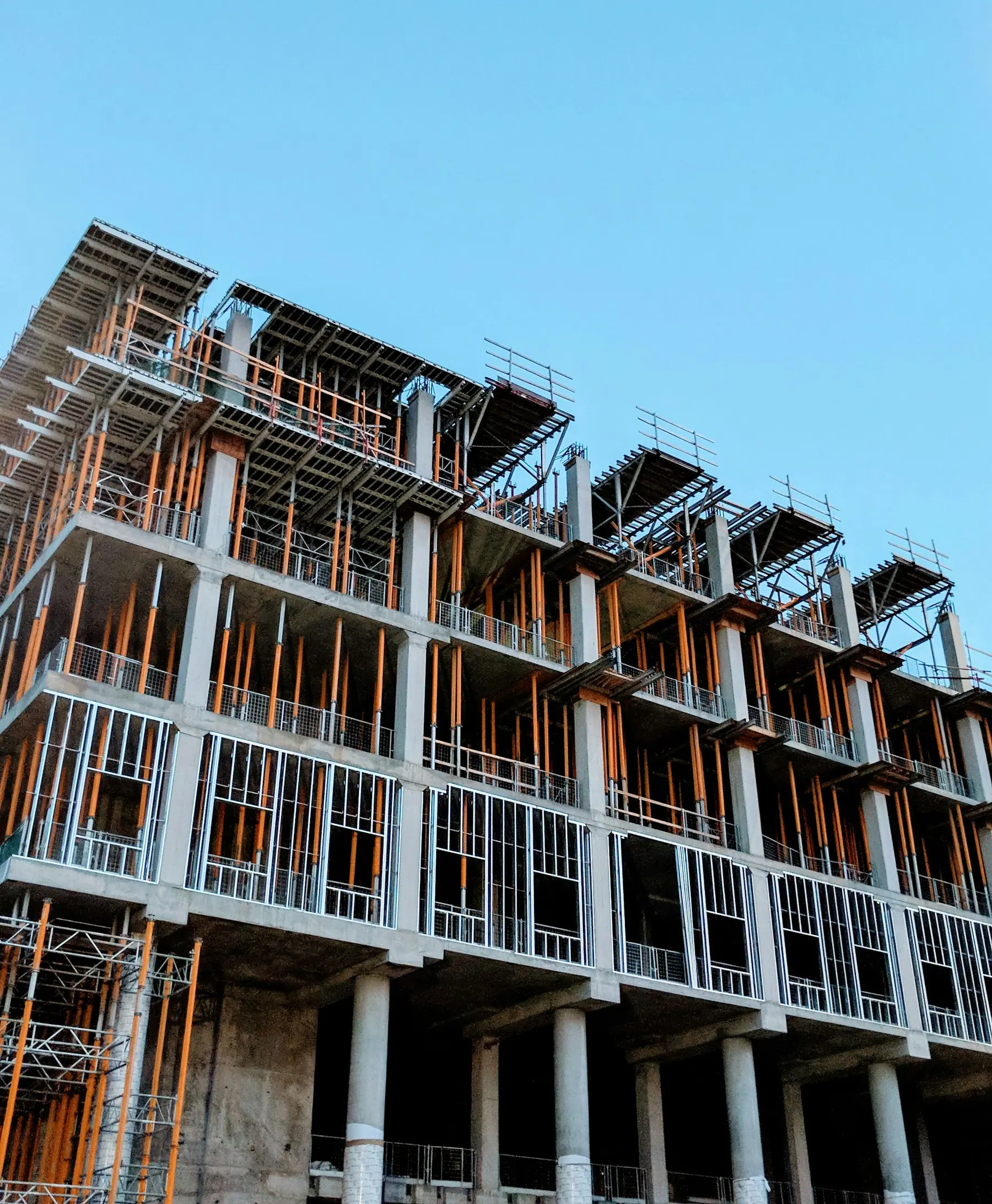 Concrete structure under construction with scaffolding